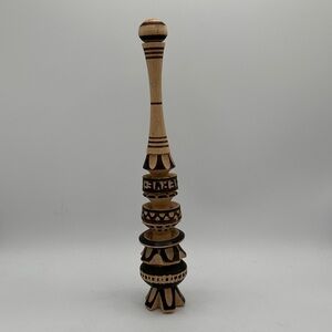 Traditional Mexican wooden whisk (molinillo) for beverages